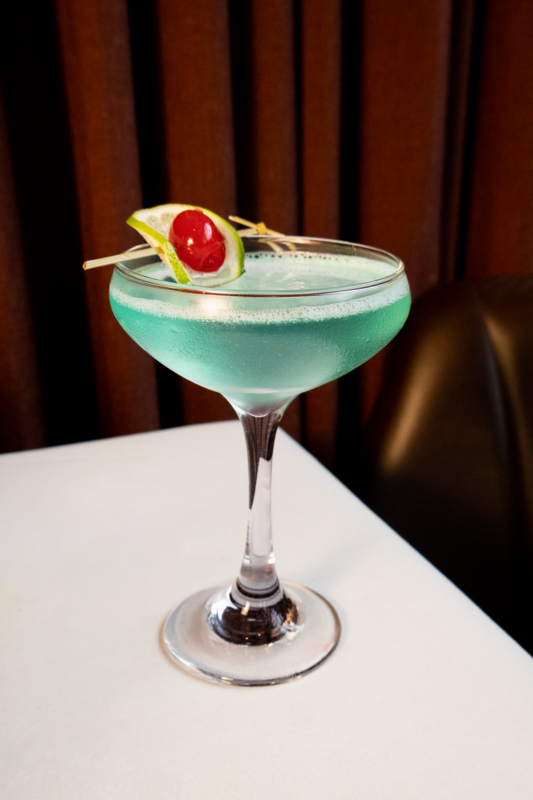 Jolly Rancher cocktail served in a coupe glass at Chama Gaúcha Houston happy hour